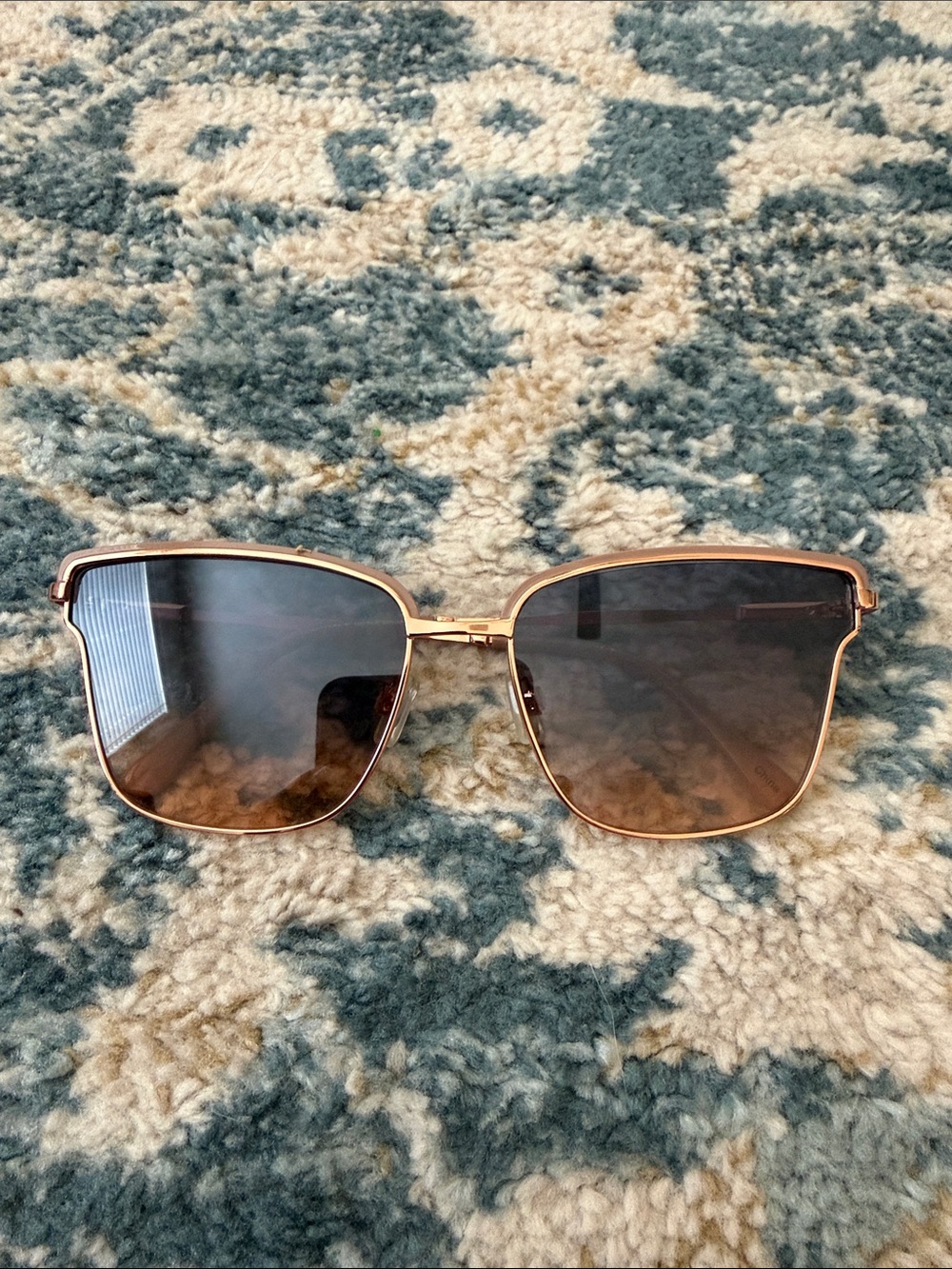 Nanette Lepore rose gold metal sunglasses with brown gradient lenses
